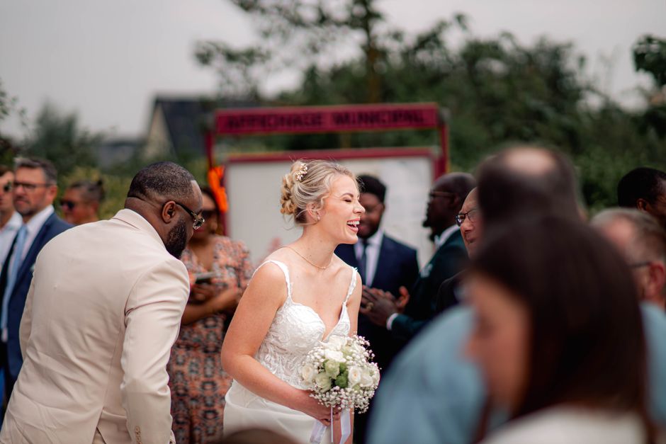 Candid engagement photos of a laughing couple
